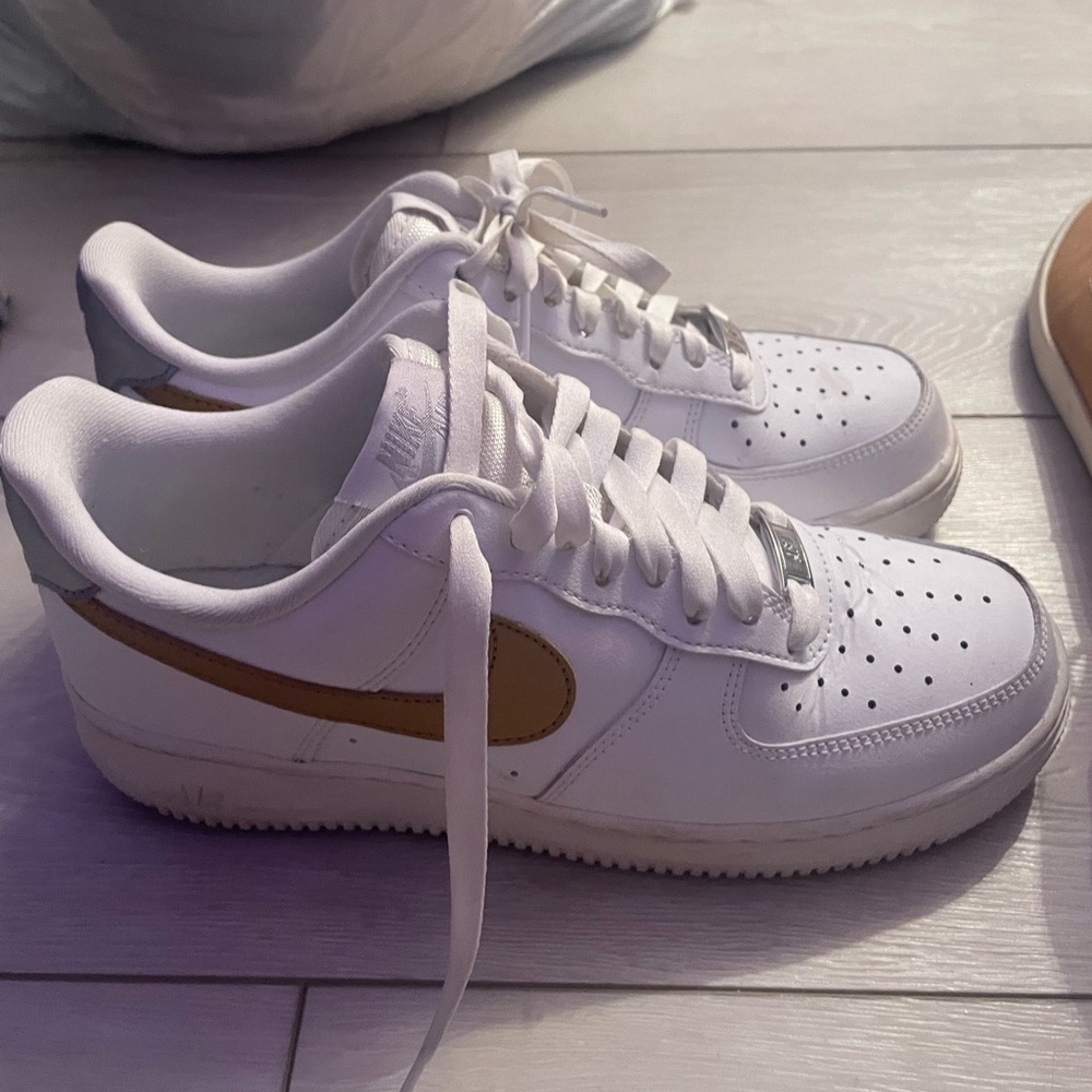 Nike air forces with gold and silver pattern